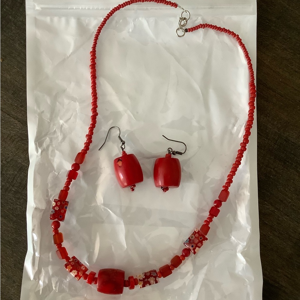 Red stone and glass bead necklace with matching earrings.